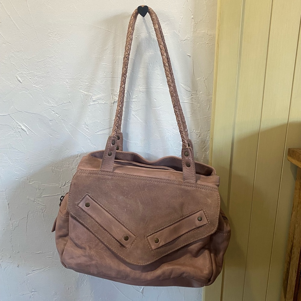 Free people light pink shoulder bag.
